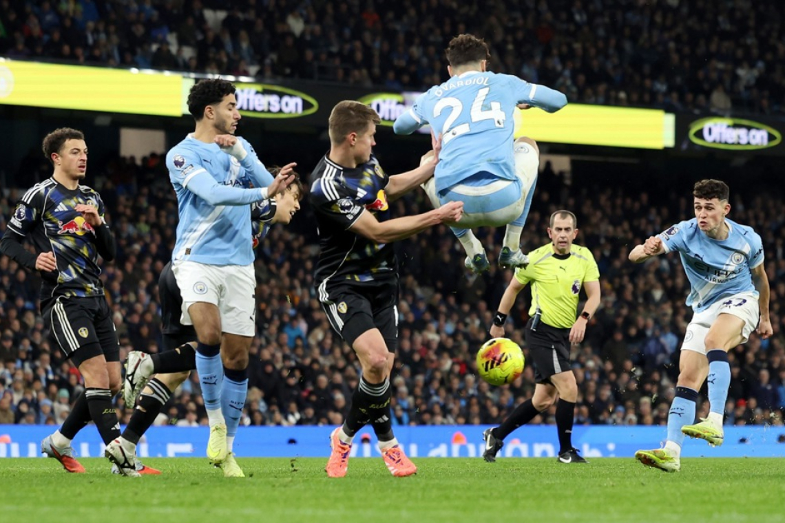 Manchester City po razburljivi tekmi bližje Arsenalu